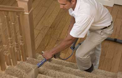 Chem-Dry technician cleans carpeted stairs