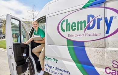 Chem-Dry technician exits carpet cleaning company van