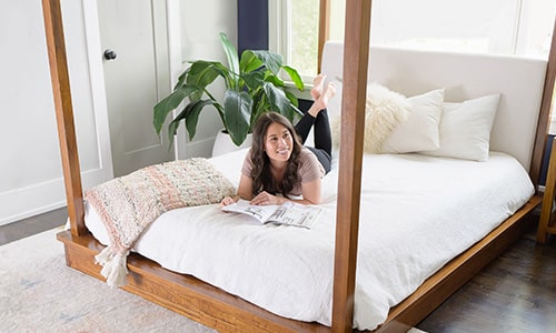 Woman on clean mattress