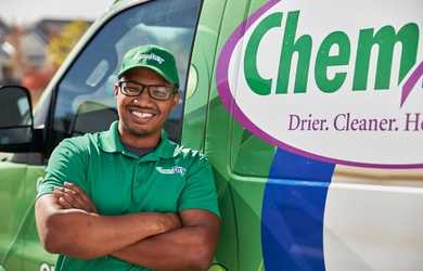 Commercial carpet cleaning technician outside Chem-Dry Truck