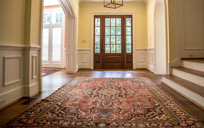 Oriental rug in foyer of home